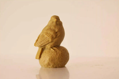 Sitting on Stone Bird Candle 5x3 inches