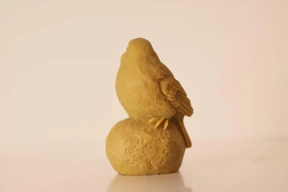 Sitting on Stone Bird Candle 5x3 inches