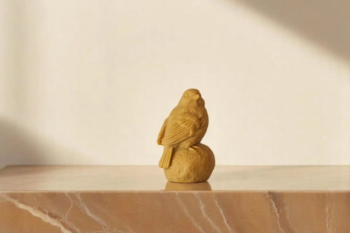 Sitting on Stone Bird Candle 5x3 inches